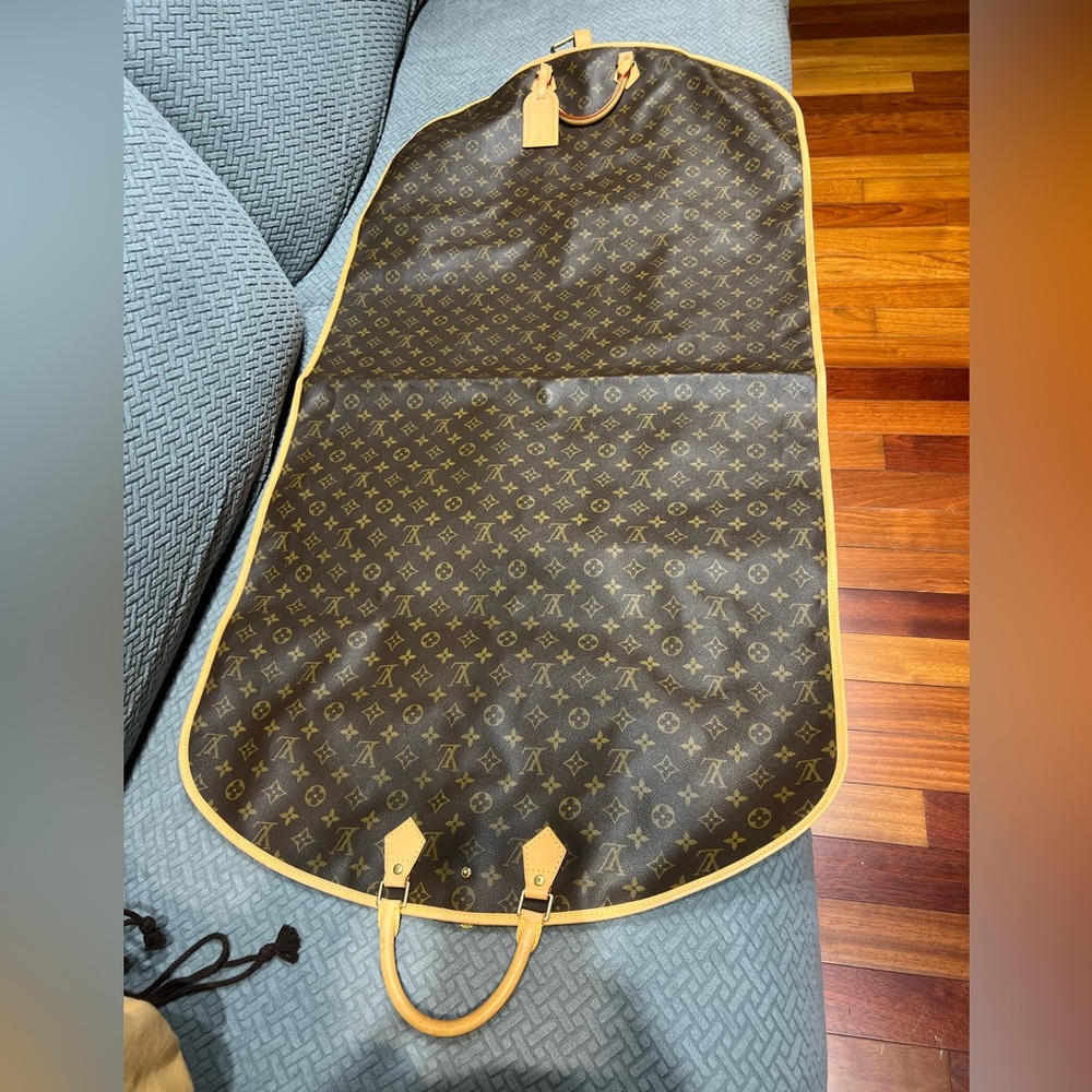 Luis Vuitton monogram garment carrier bag.